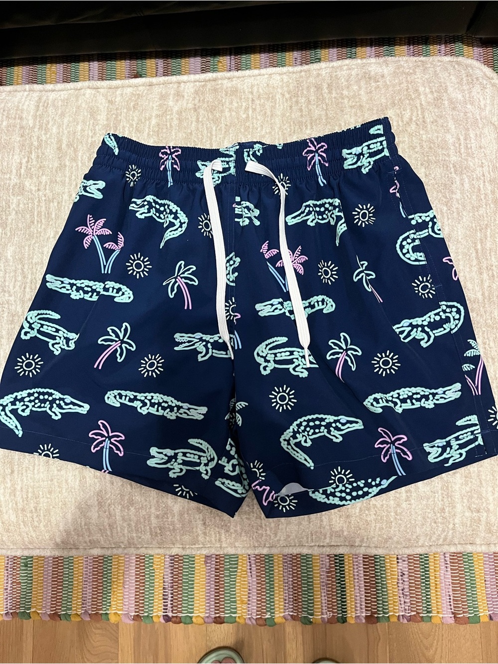Chubbies Navy Swim Trunks with Mint Alligator and Pink Accents. 5.5 inch